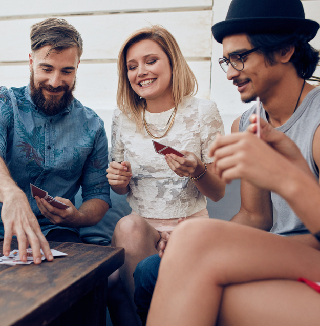 Group of friends sitting around table